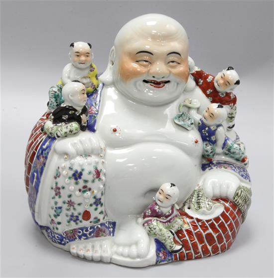 A Chinese ceramic Buddha, height 26cm, width 26cm
